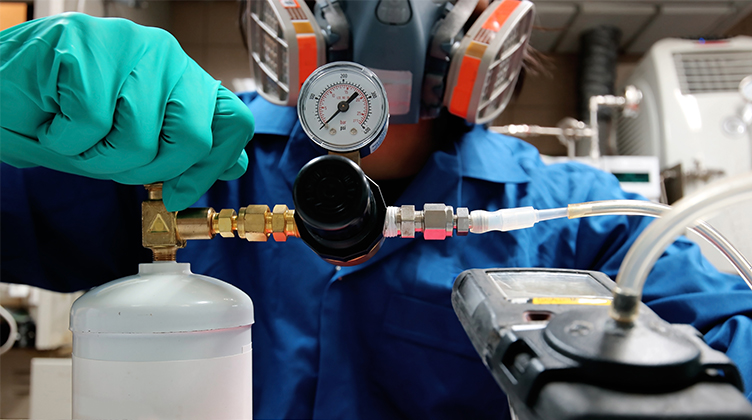 Technician Calibrating Gas Detector